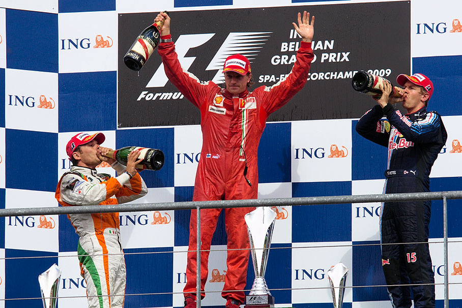 Finally a sip of Champagne for Fisichella and Vettel, race winner Kimi Raikkonen hails the audience