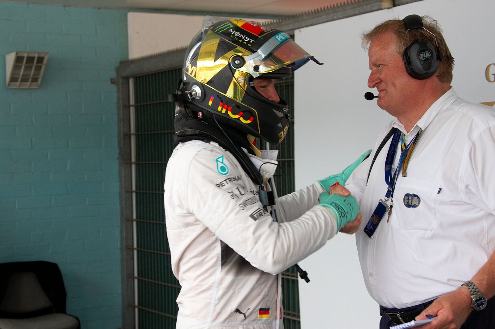 German Grand Prix winner Nico Rosberg with the FIA Formula 1 Technical Delegate at Grand Prix races, Jo Bauer