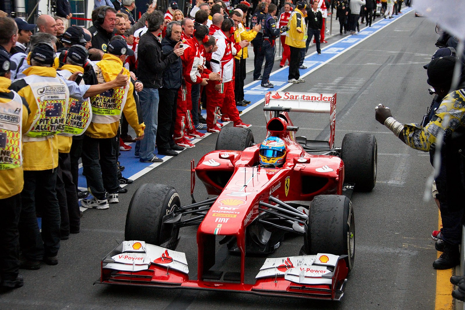 Second paced Fernando Alonso of Ferrari rolls to parc ferme