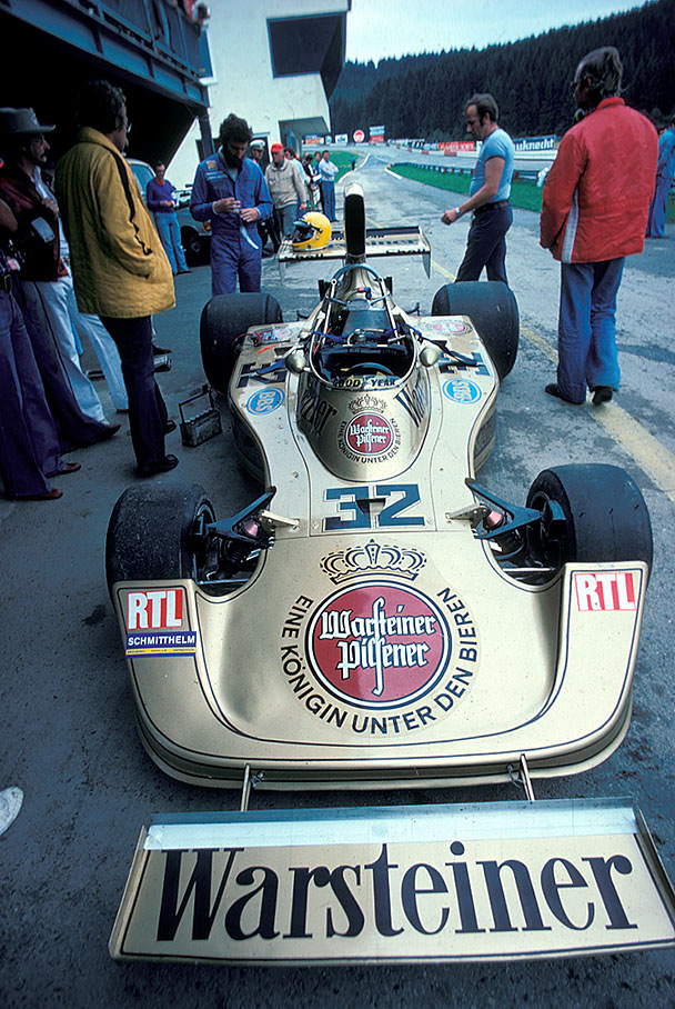 Harald Ertl (D) behind his Hesketh-Cosworth 308 at pits