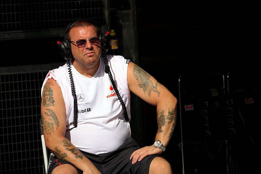 Tattooed McLaren 'tyre manager' watches the race