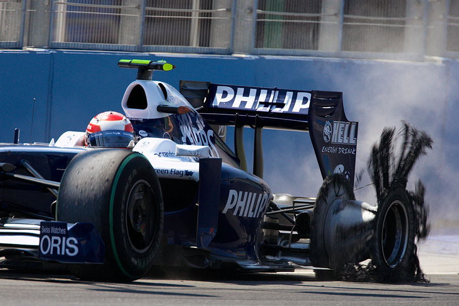 A tyre puncture forces Nakajima to drive slowly back to pits