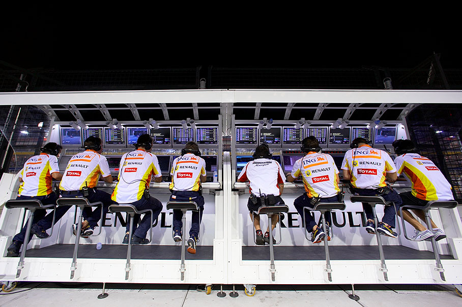 Renault F1 engineers sit at their pitwall command center