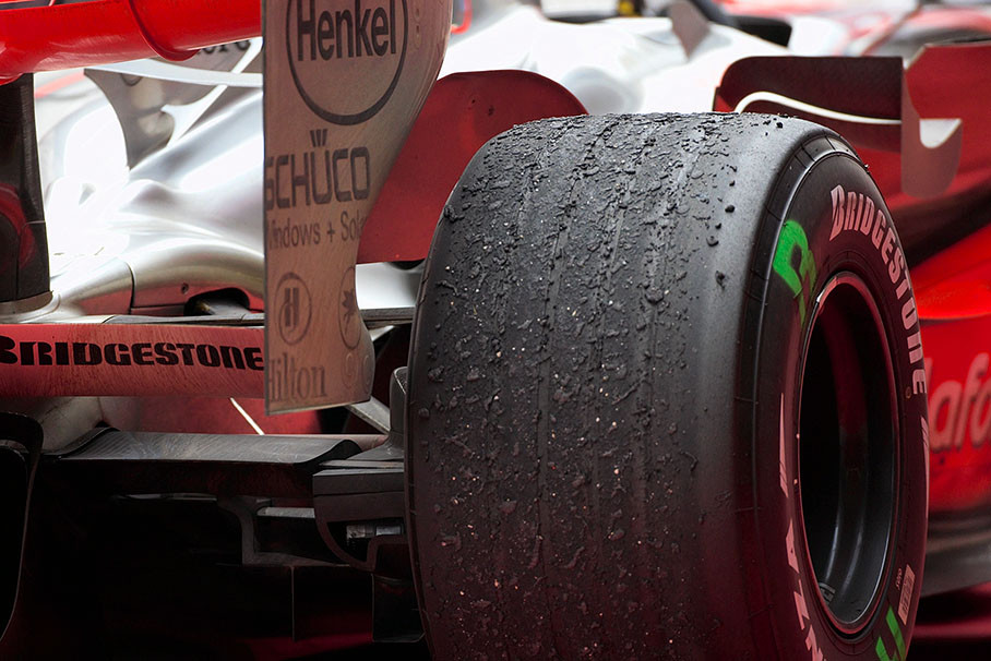 Collected rubber marbles on a McLaren's left rear tire after a race