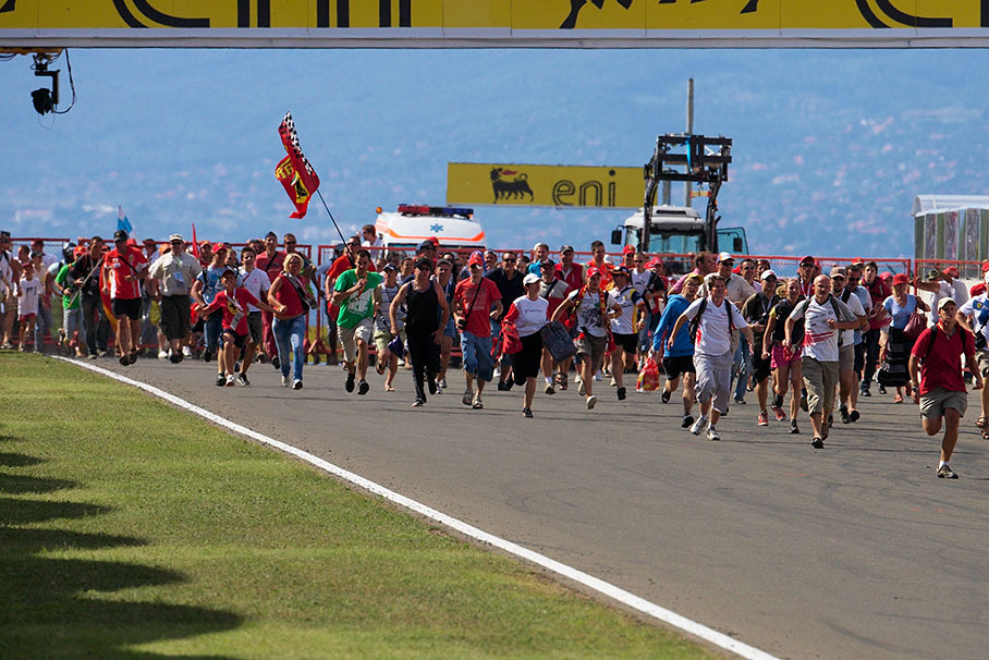 Track invasion by the race fans a during podium ceremony
