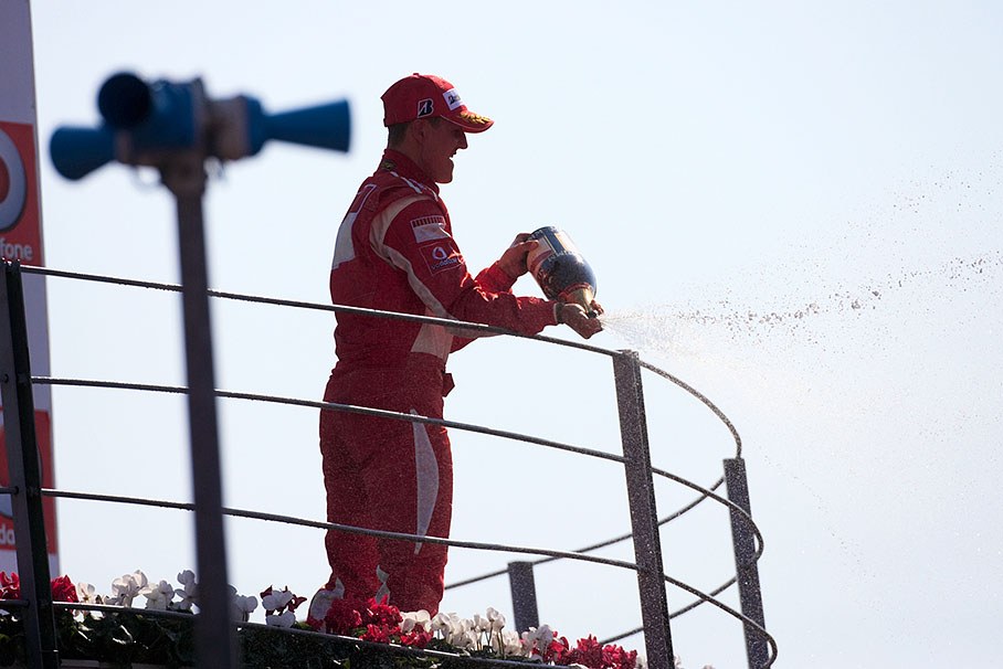 Michael Schumacher spraying some dashes of french sizzly nectar