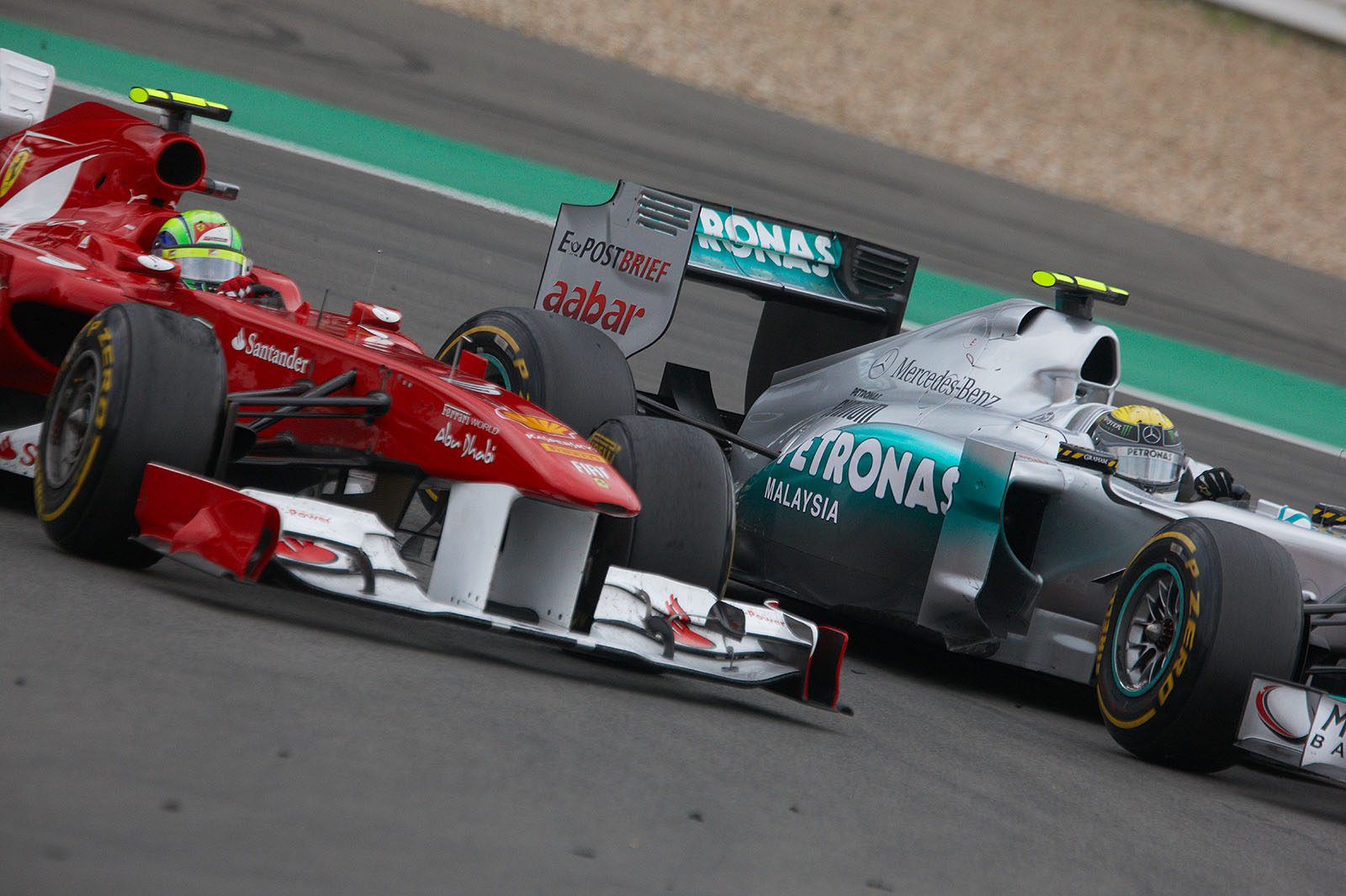 Felipe Massa of Ferrari finaly overtakes Rosberg's Mercedes