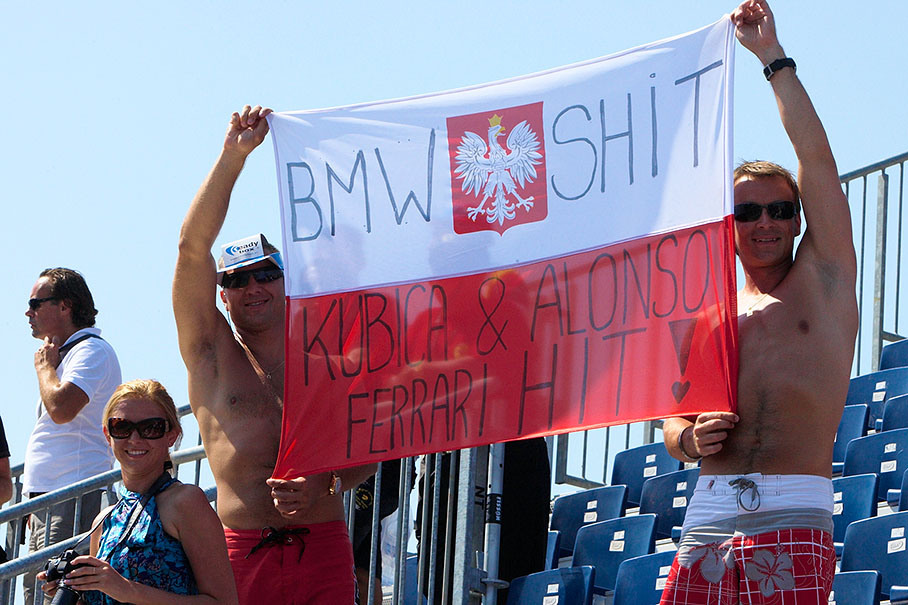Race fans from Poland present a meaningful national banner