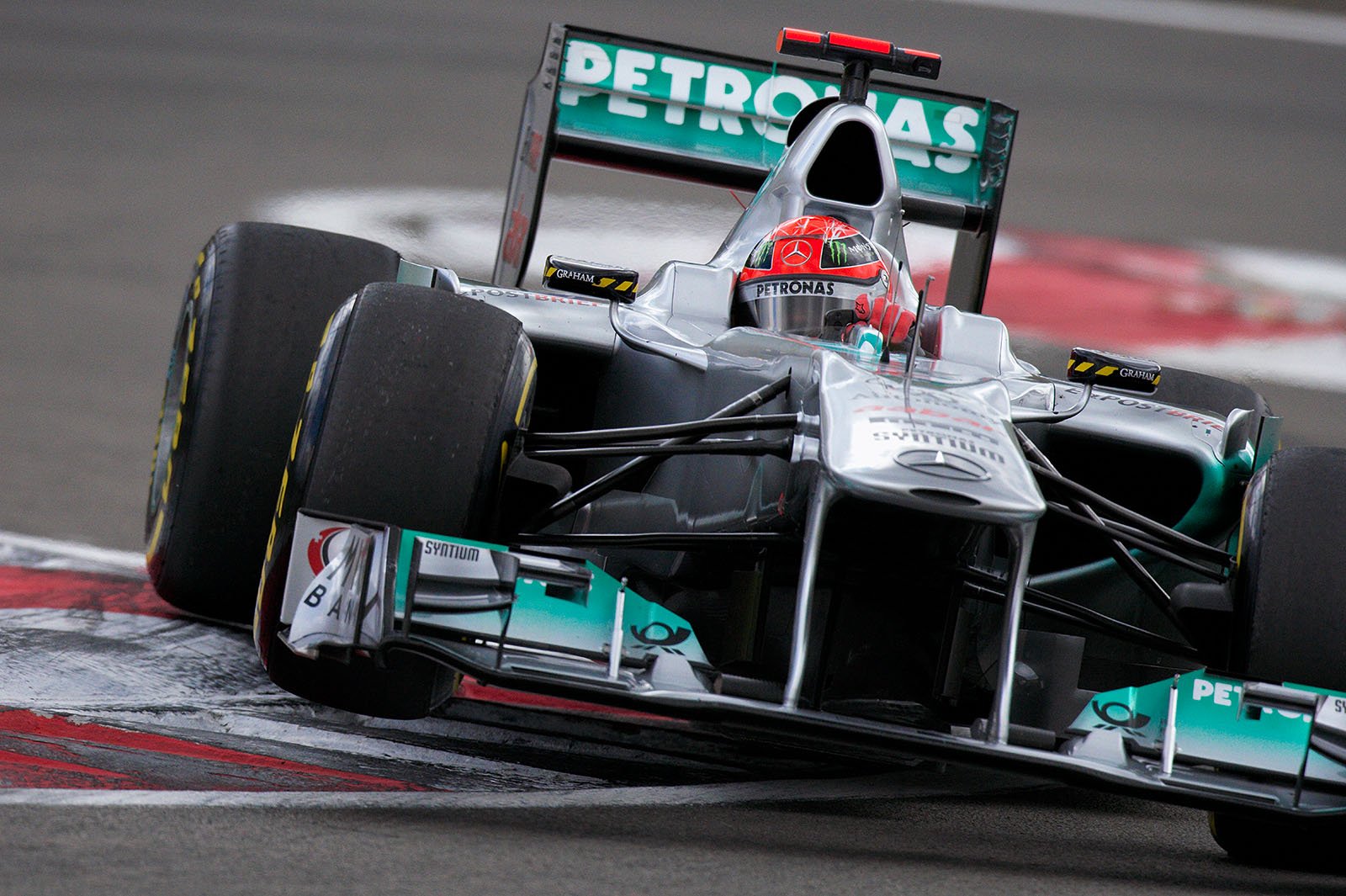 Michael Schumacher, Mercedes GP, shaves over the curbs