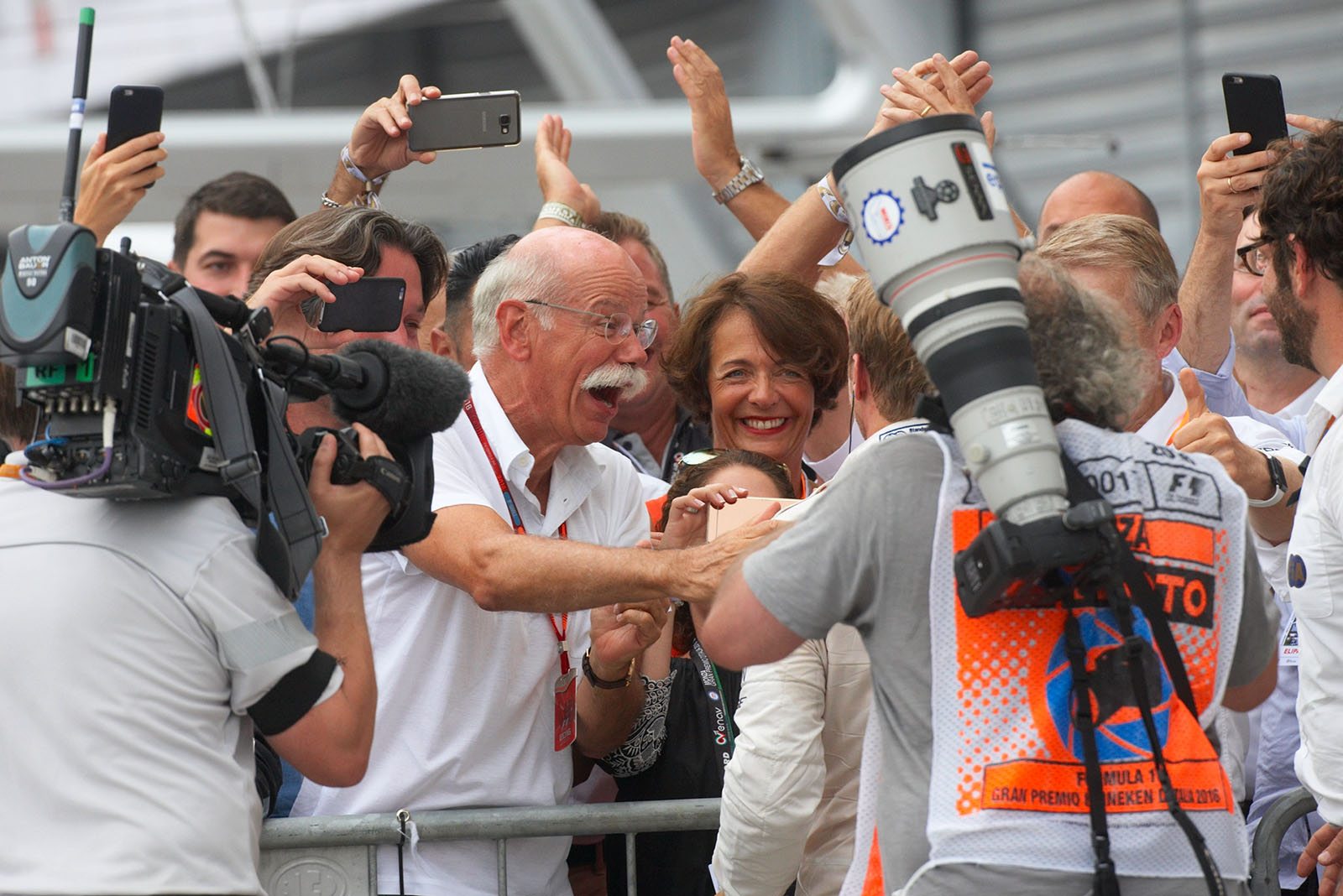 Dieter Zetsche of Mercedes, congratulates his winning driver Rosberg in parc ferme, Monza, Italian Grand Prix, 2016