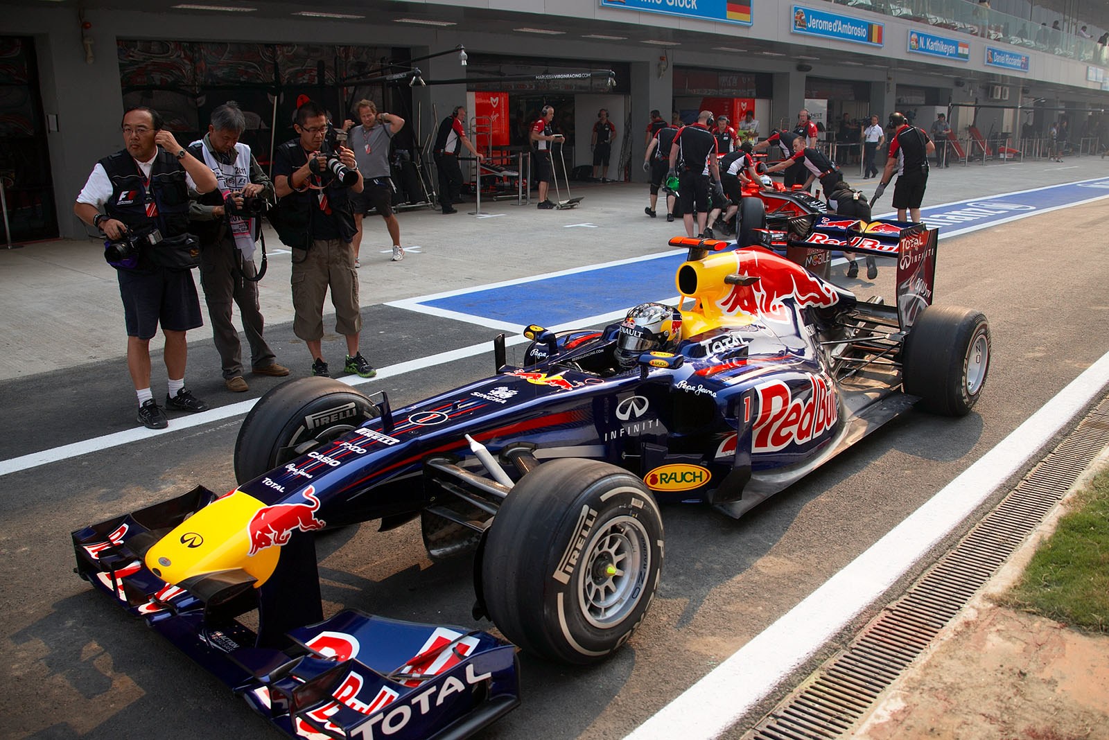 Sebastian Vettel's Red Bull Racing-Renault car stops in the pitlane with a stalled engine