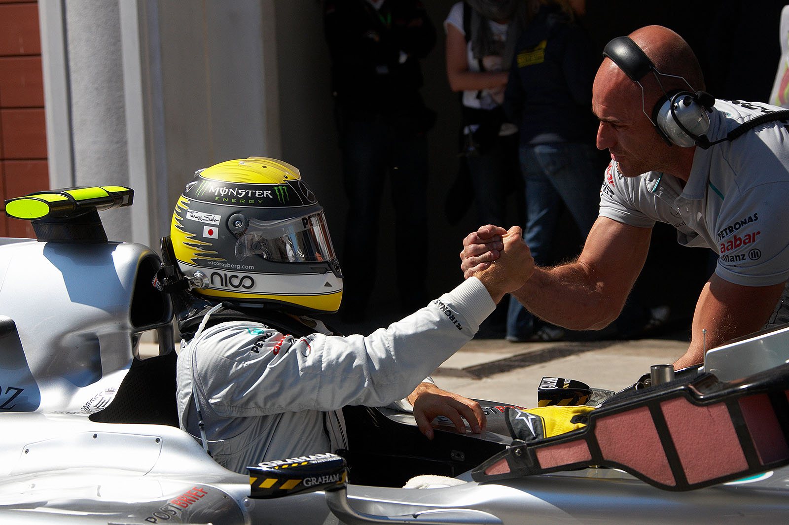 Nico Rosberg gets congrats from a Mercedes GP mechanic after gaining third grid position on Saturday afternoon