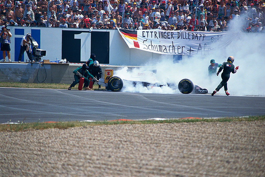 Lotus driver Alex Zanardi retires with a burning Mugen-Honda engine