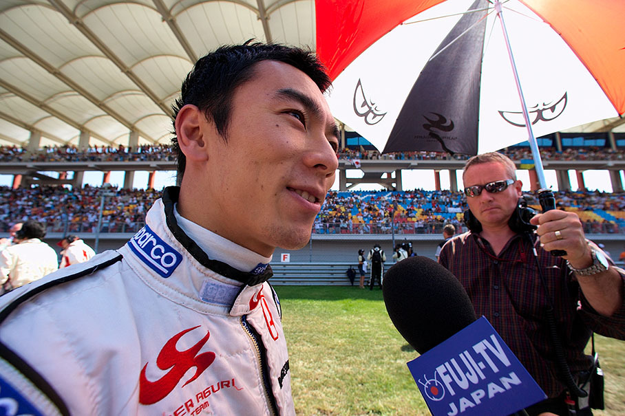 Takuma Sato gives an interview on the grid