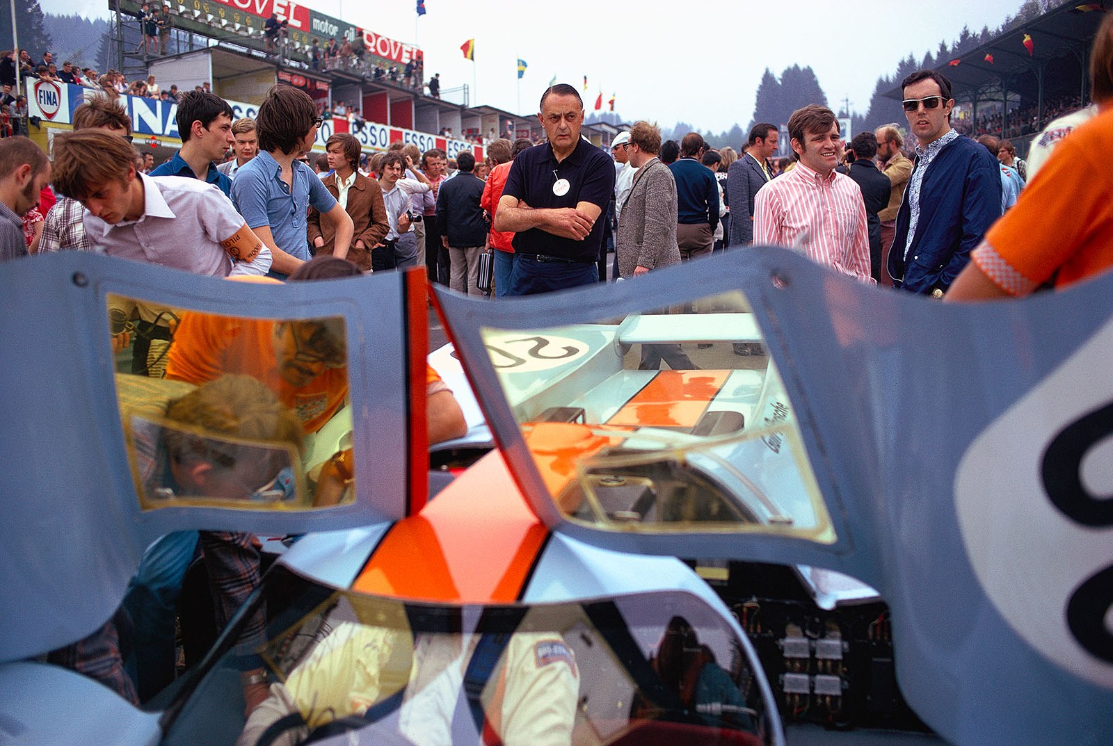 Team boss John Wyer on the grid besides the Porsche 917K 014/029 driven by Jo Siffert and Derek Bell before he start of the 1000 km Spa 1971
