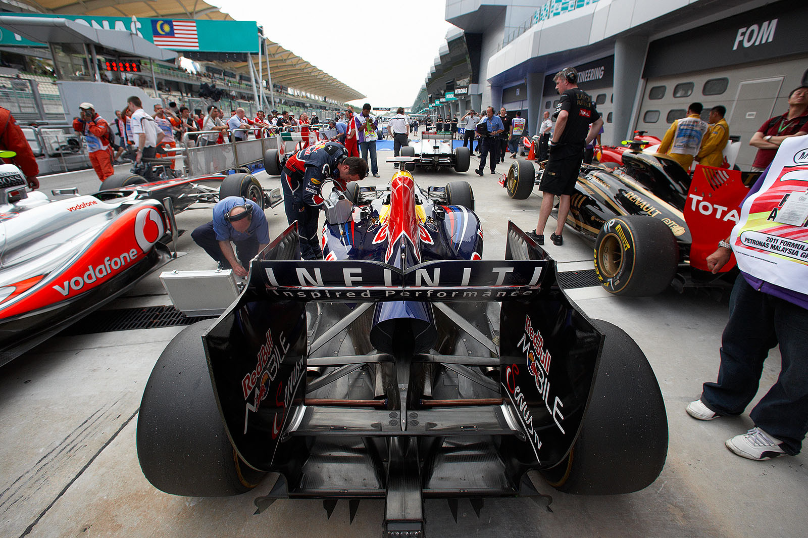 A Red Bull-Renault is checked in parc ferme after qualifying