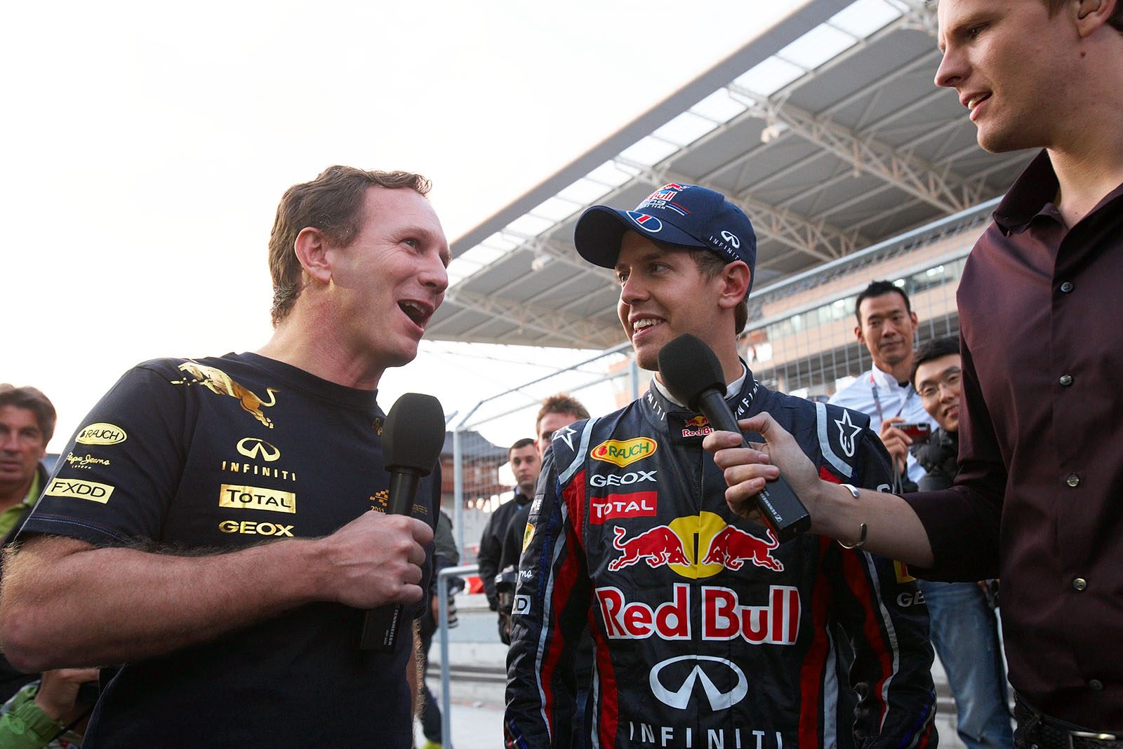 Race winner Sebastian Vettel and Red Bull Racing team boss Christian Horner celebrate their win of the F1 constructor championship after the Korean GP
