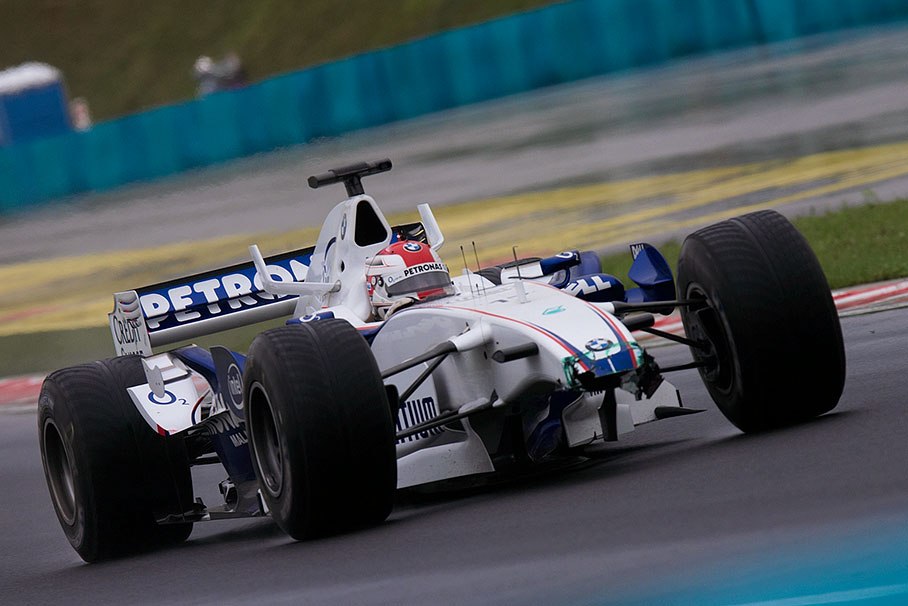 Robert Kubica with a damaged car nose after a spin