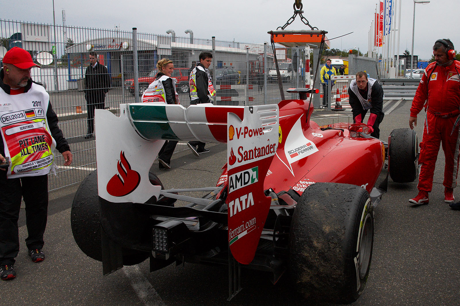 Alonso's Ferrari car is returned to pits after the race, ultra light with low fuel