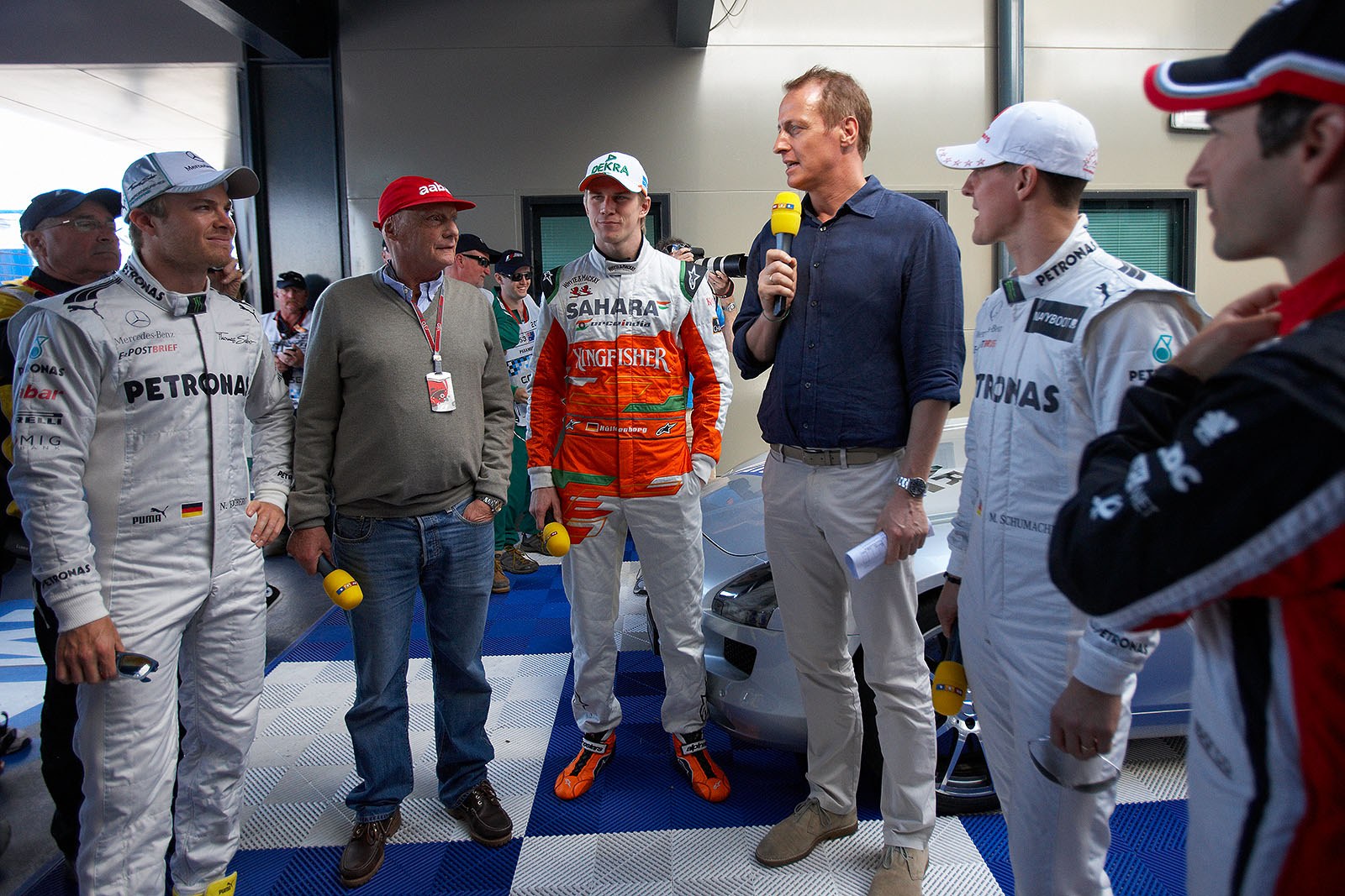 German TV RTL presenters Niki Lauda and Florian Koenig interview the German drivers before their drivers parade