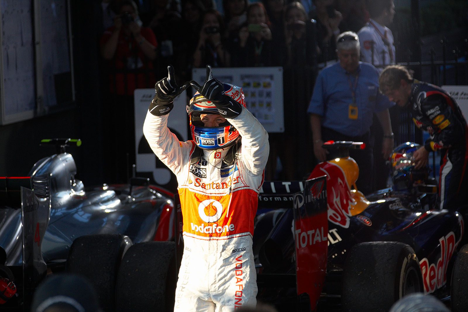Race winner Jenson Button of McLaren celebrates his achievement in parc ferme