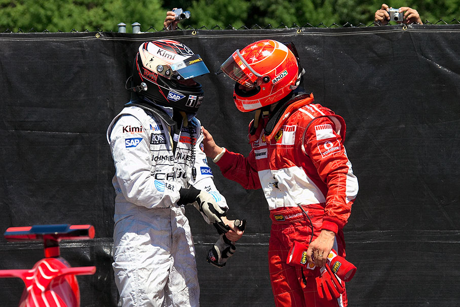 Michael Schumacher and Kimi Raikkonen - perhaps exchanging their experiences in playing with marbles and bowls, especially in last laps ;)