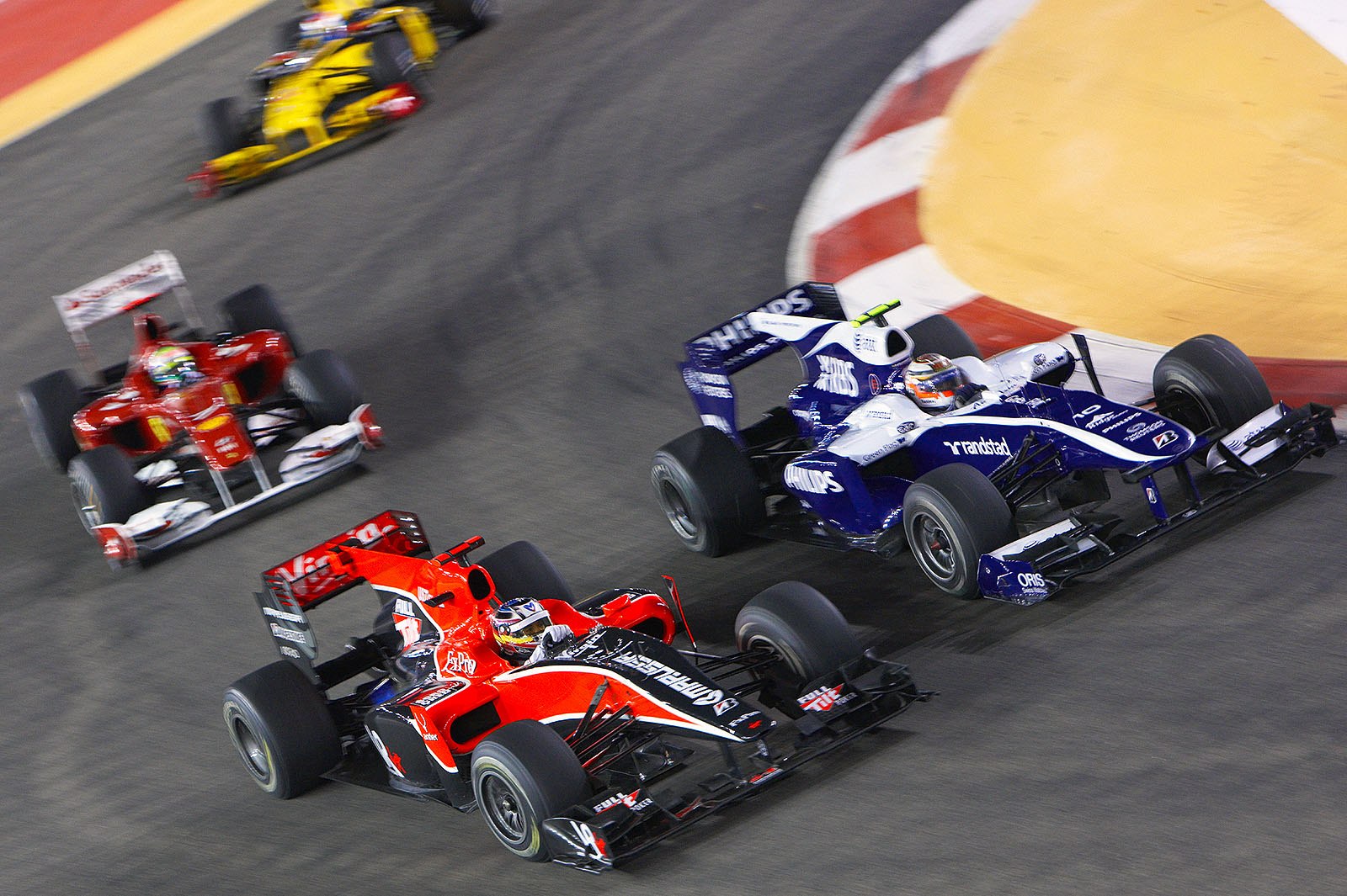 Timo Glock, Virgin Racing, lets Huelkenberg pass by