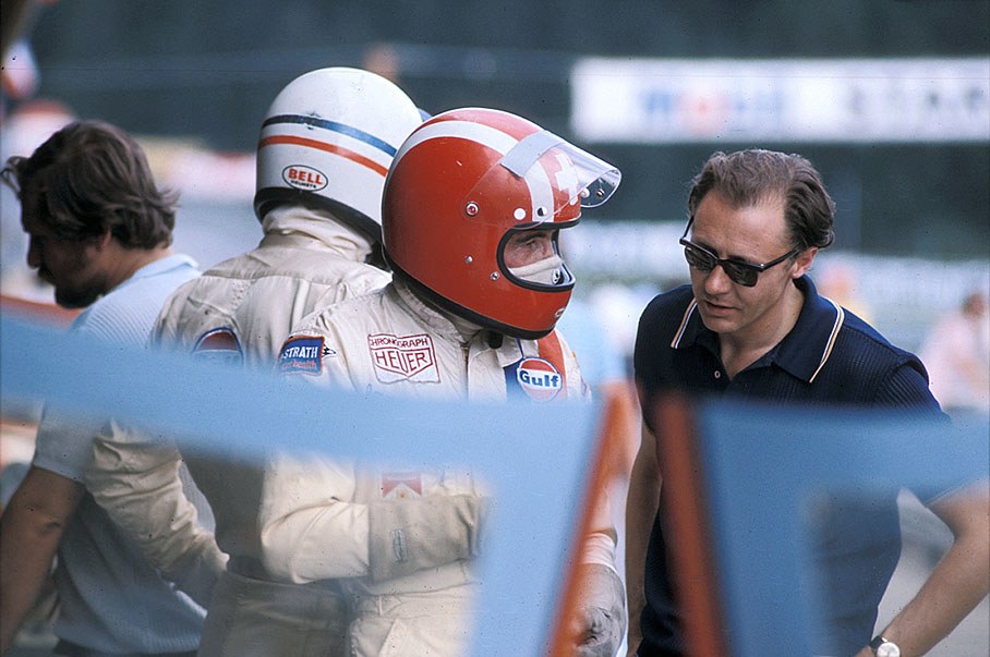 Jo Siffert (CH) and Derek Bell (GB) in helmets behind John Wyer's Porsche 917K 004/017