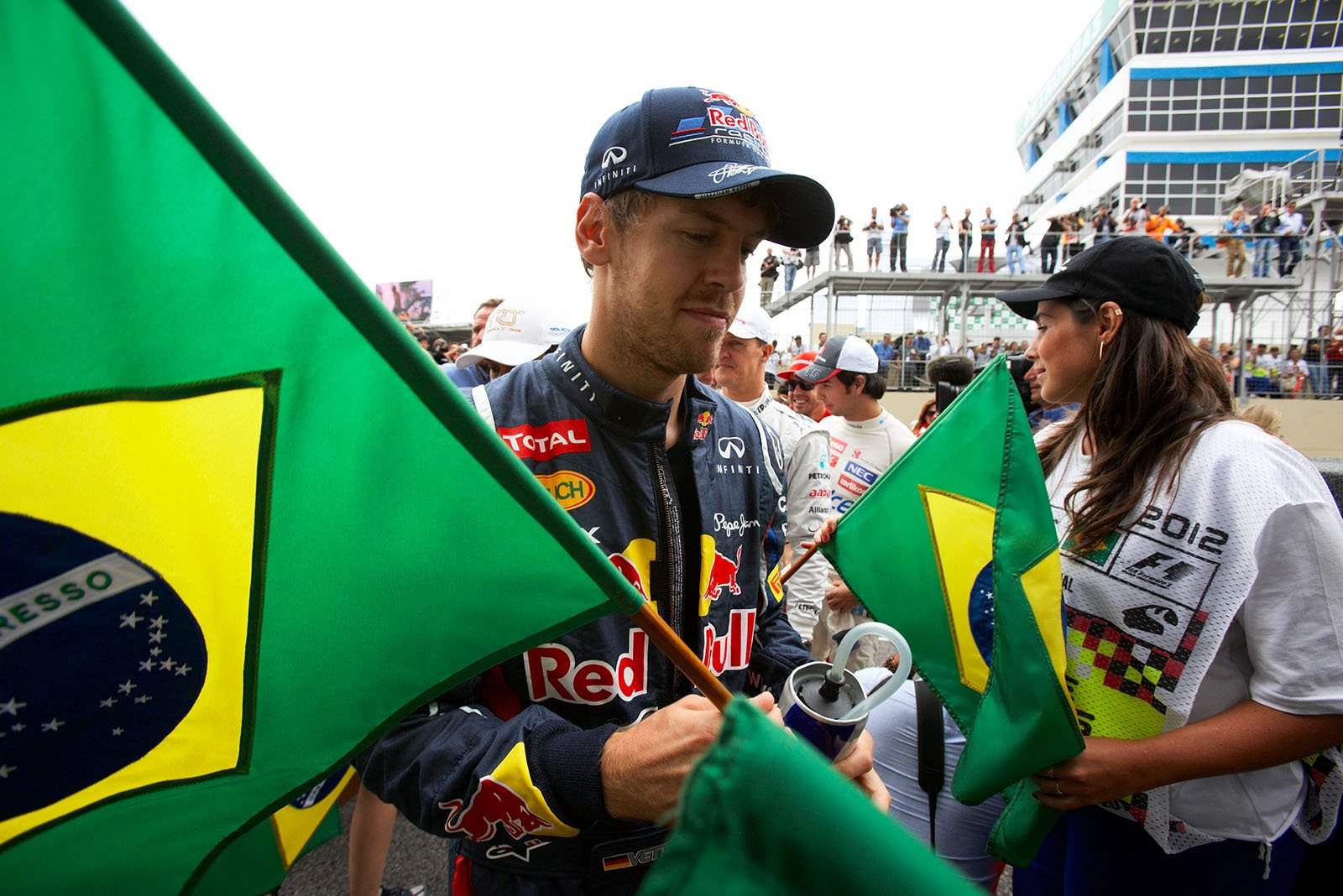 Sebastian Vettel, Red Bull Racing, takes a Brazilian banner and  walks to the drivers presentation