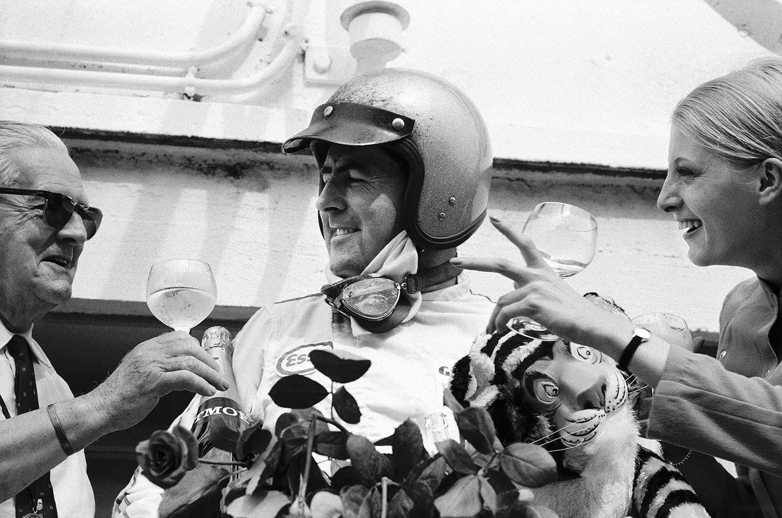 Jack Brabham wins the French Le Mans Grand Prix 1967, overwhelmed by french hospitality and the sponsor's fluffy tiger