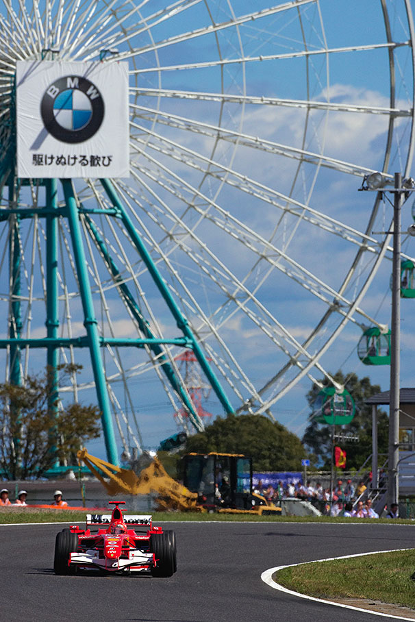 Michael Schumacher in front of the famous Suzuka landmark, the theme park's giant wheel