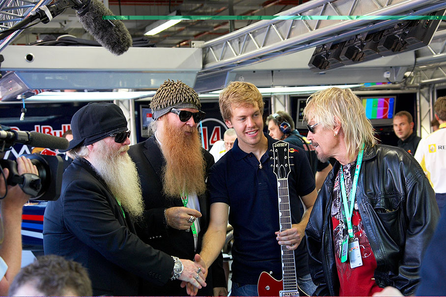 Billy Gibbons, Dusty Hill and Frank Beard of the American bluesrock band ZZ Top visit Sebastian Vettel in Red Bull pits