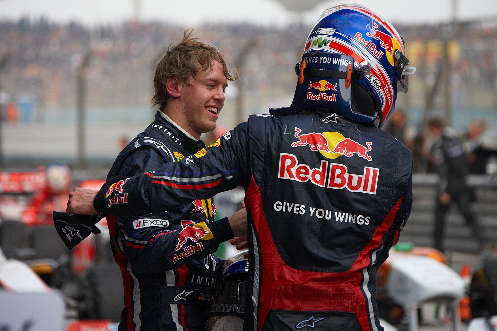 Second placed Vettel and third Webber celebrate in parc ferme after the Chinese GP