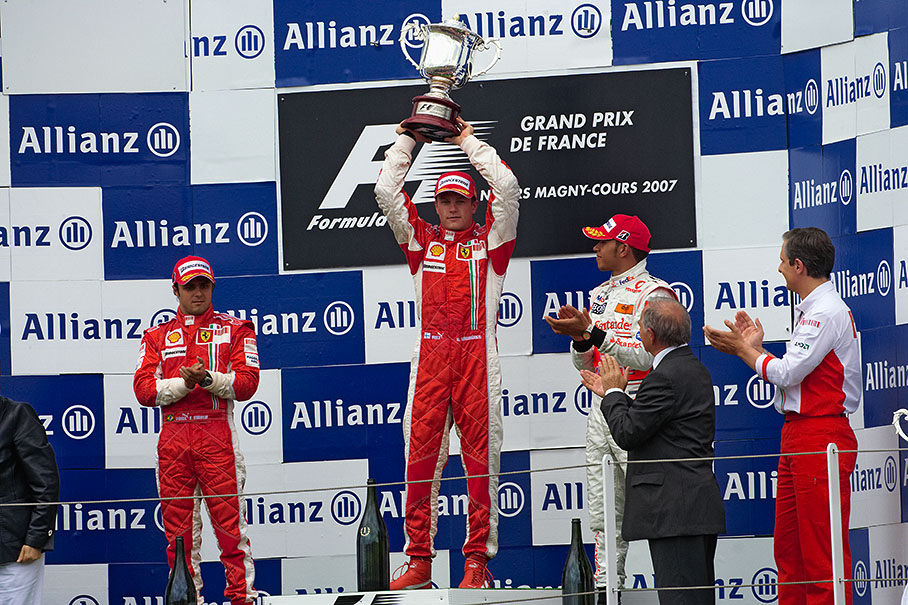 Kimi Raikkonen raises his trophy