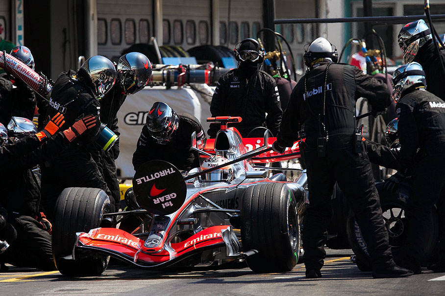 Kimi Raikkonen on his first pit stop of three after 10 laps only, losing his leading position "due to a crossed wheel nut" at rear right wheel (refering to formula1.com).