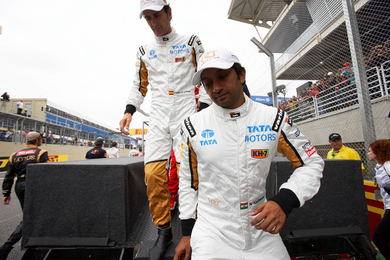 HRT race drivers Narain Karthikeyan and Pedro de la Rosa on their way to drivers presentation