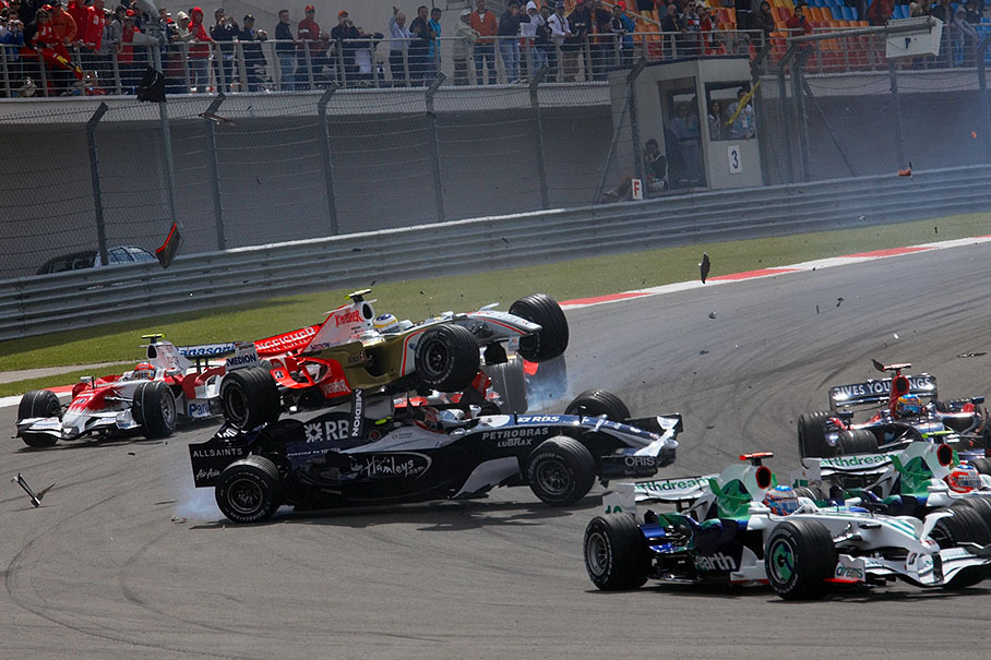 Force India driver Giancarlo Fisichella brakes too late and crashes into the rear of Kazuki Nakajima's Williams