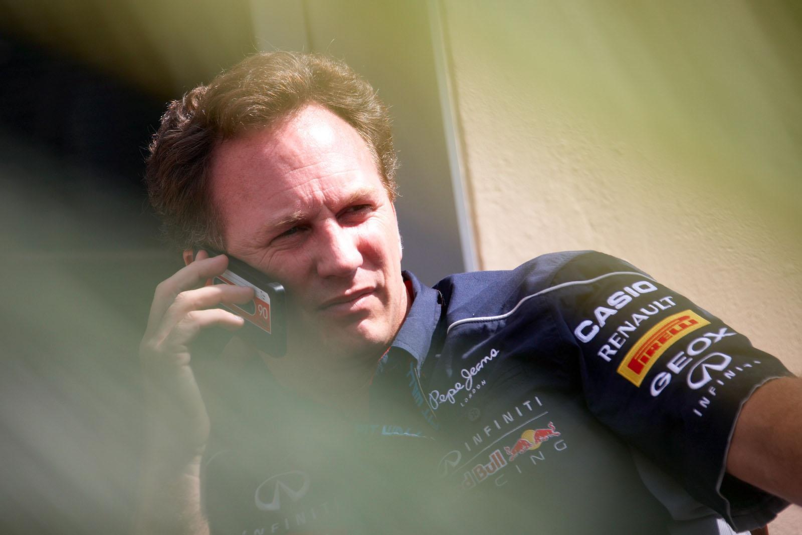 Red Bull Racing team principal Christian Horner with his cassette taped mobile