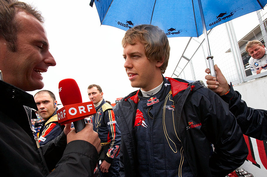 Toro Rosso ace Sebastian Vettel is being interviewed on the grid by Austrian TV