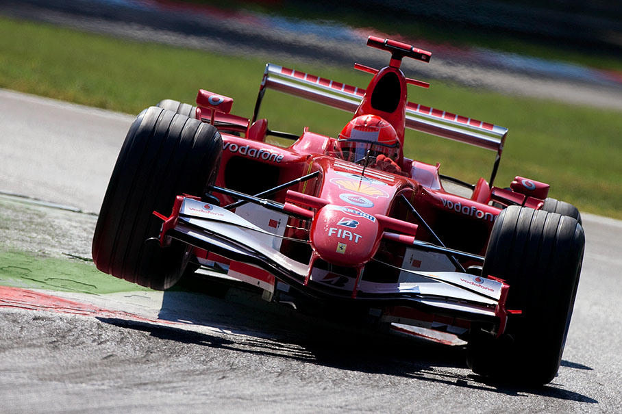 Ferrari's Michael Schumacher curbing
