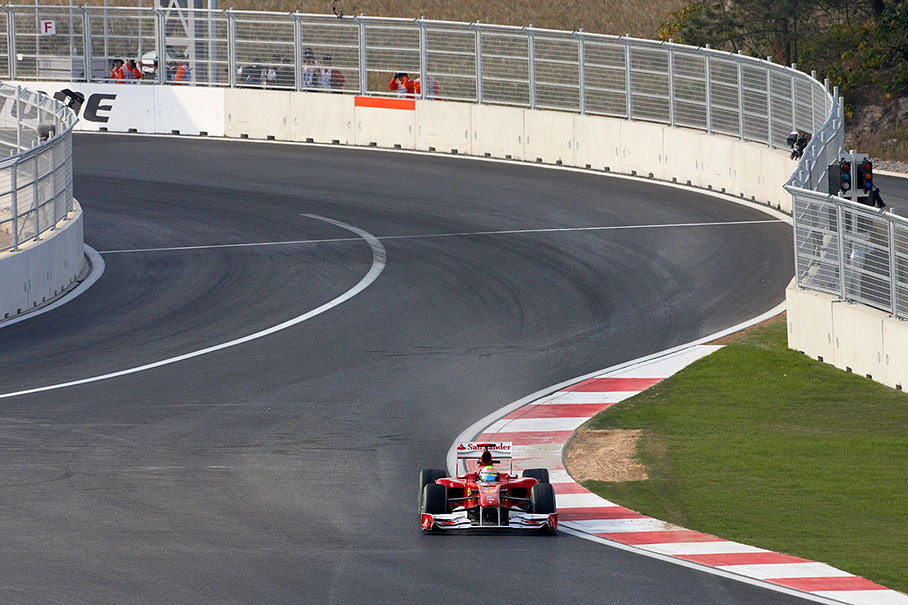 Felipe Massa, Ferrari, slides over the damaged curbs at the last turn