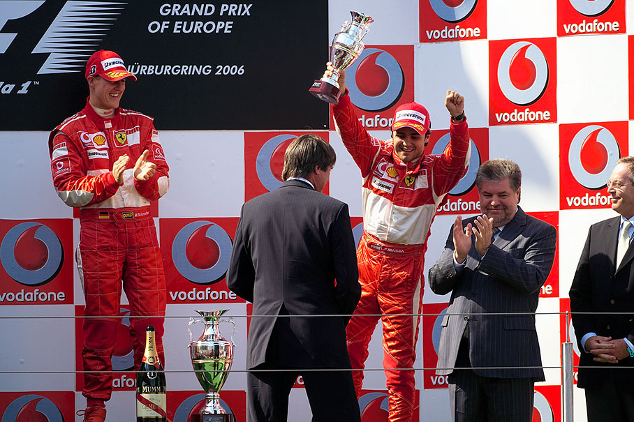 Happy Felipe Massa shaking his trophy and fist