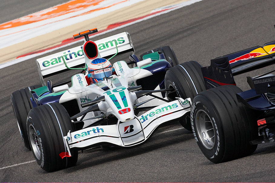 Honda driver Jenson Button behind Webbers Red Bull