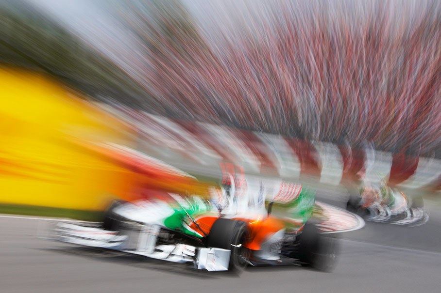 Adrian Sutil in front of Force India F1 team mate Liuzzi