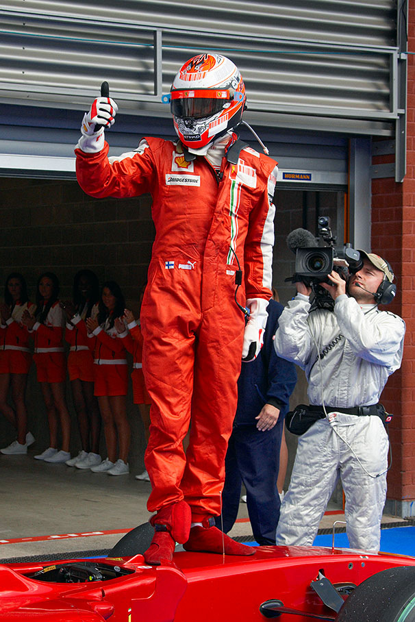 Race winner Kimi Raikkonen jubilates about his first season win for Ferrari