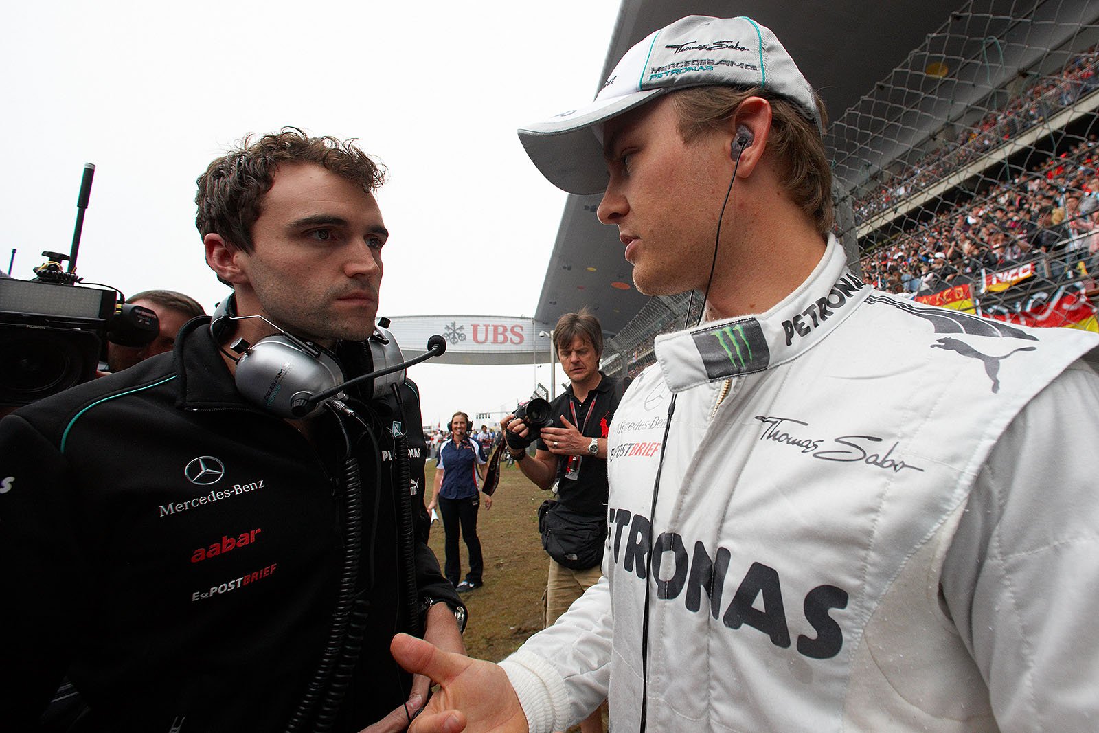 Nico Rosberg, Mercedes GP, on the grid before the race with one of his helpers