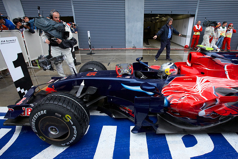 Incredible polesetter Sebastian Vettel arrives at parc ferme