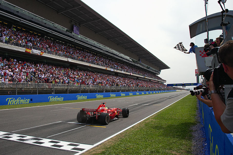 Winner Felipe Massa passes finish line and chequered flag