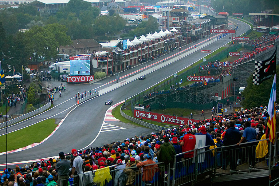 The two McLarens (Montoya and Raikkonen) leading the early race into Eau Rouge.