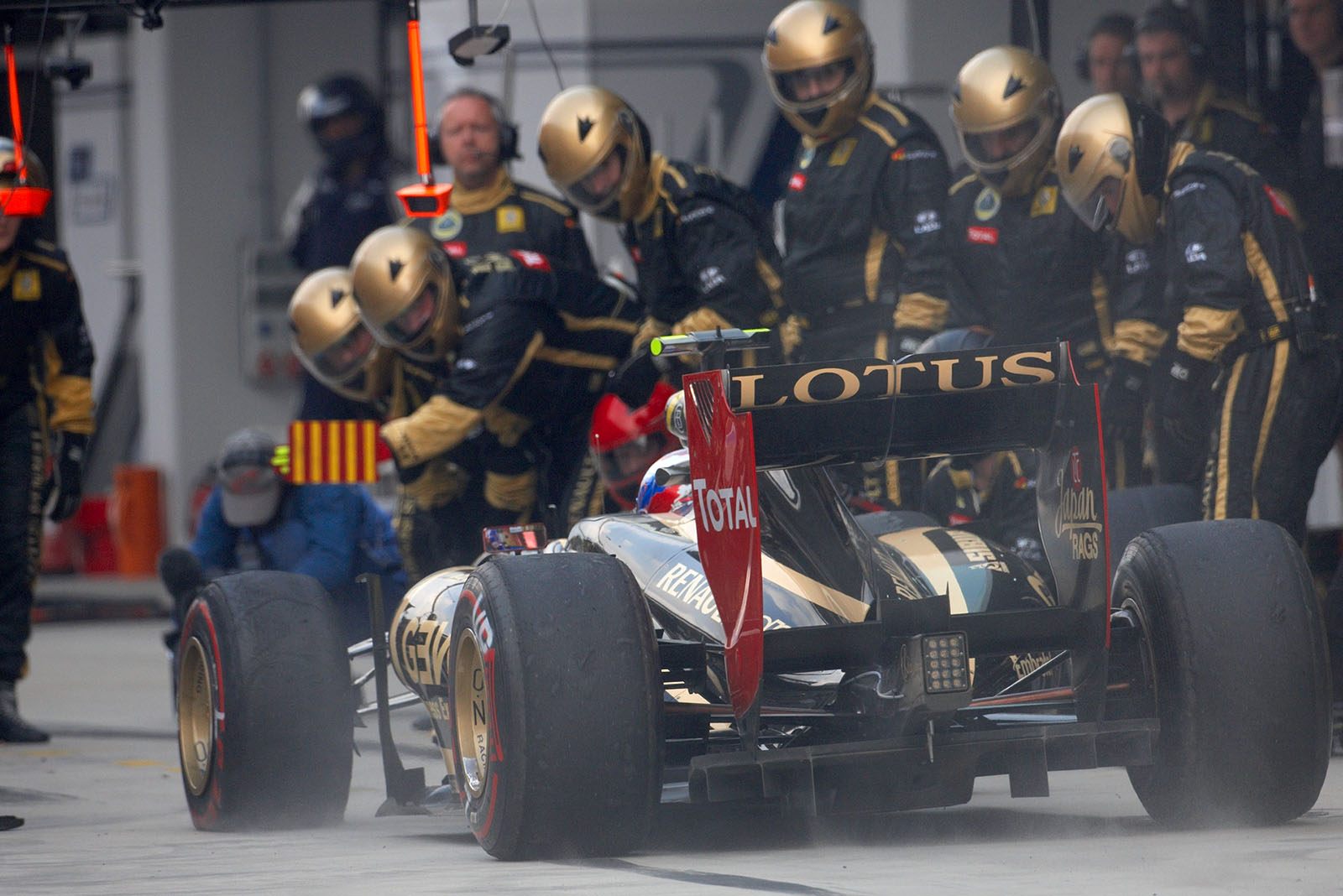 Pit stop of Vitaly Petrov at Lotus Renault GP pits after his collision with Schumacher